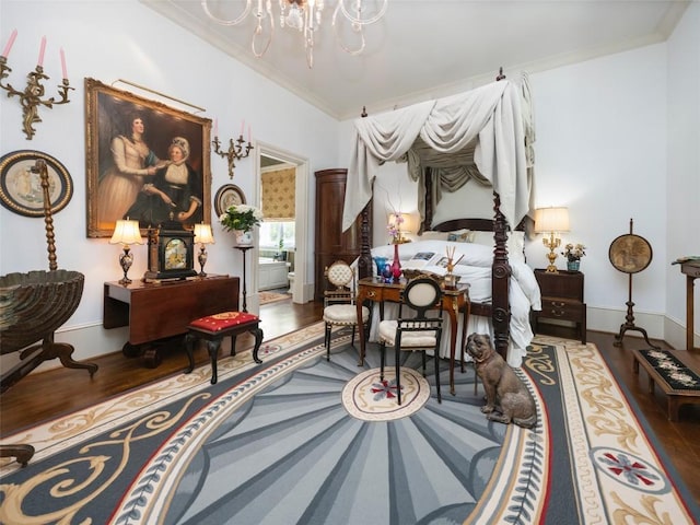 13084 Canada Rd, Tuckasegee, NC 28783 - bedroom with wood finished floors, a chandelier, ornamental molding, and baseboards