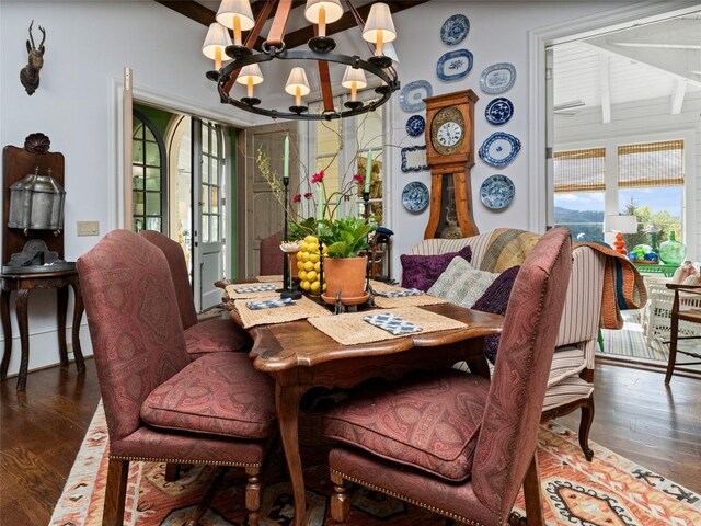 13084 Canada Rd, Tuckasegee, NC 28783 - dining room with a chandelier, wood finished floors, beamed ceiling, and baseboard heating