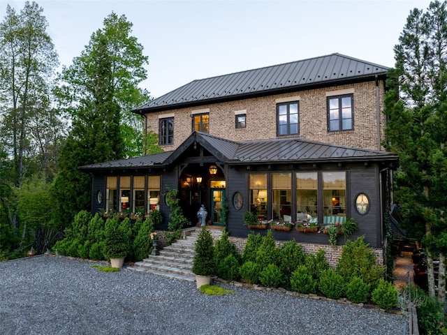 13084 Canada Rd, Tuckasegee, NC 28783 - view of front of house with a standing seam roof, metal roof, and brick siding