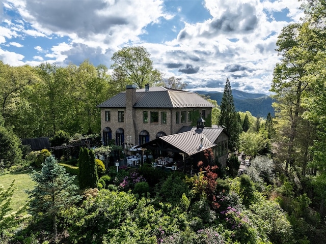 13084 Canada Rd, Tuckasegee, NC 28783 - back of property featuring a standing seam roof, metal roof, and a chimney