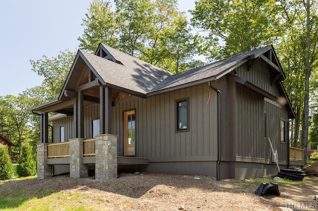 view of property exterior featuring covered porch