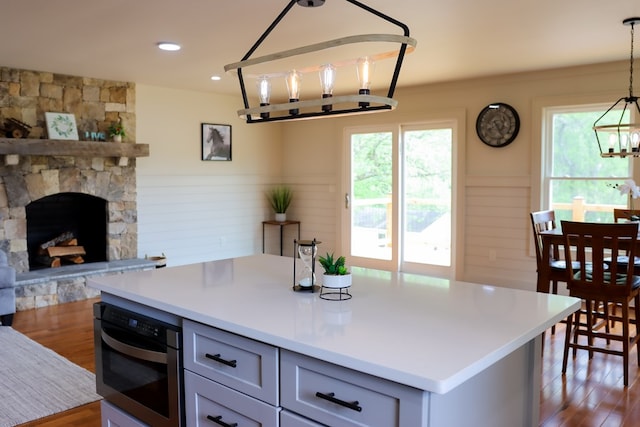 94 Breezy Knob Rd, Franklin, NC 28734 - kitchen featuring healthy amount of natural light, a chandelier, wainscoting, dark wood finished floors, and light countertops