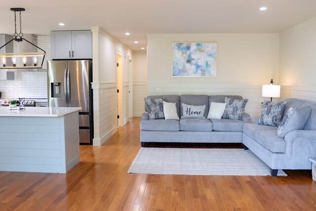 94 Breezy Knob Rd, Franklin, NC 28734 - living area featuring light wood-type flooring, recessed lighting, and a wainscoted wall