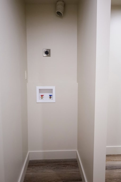 94 Breezy Knob Rd, Franklin, NC 28734 - laundry room featuring hookup for an electric dryer, washer hookup, wood finished floors, and baseboards