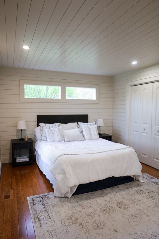 94 Breezy Knob Rd, Franklin, NC 28734 - bedroom with wood finished floors, a closet, recessed lighting, wood walls, and wood ceiling