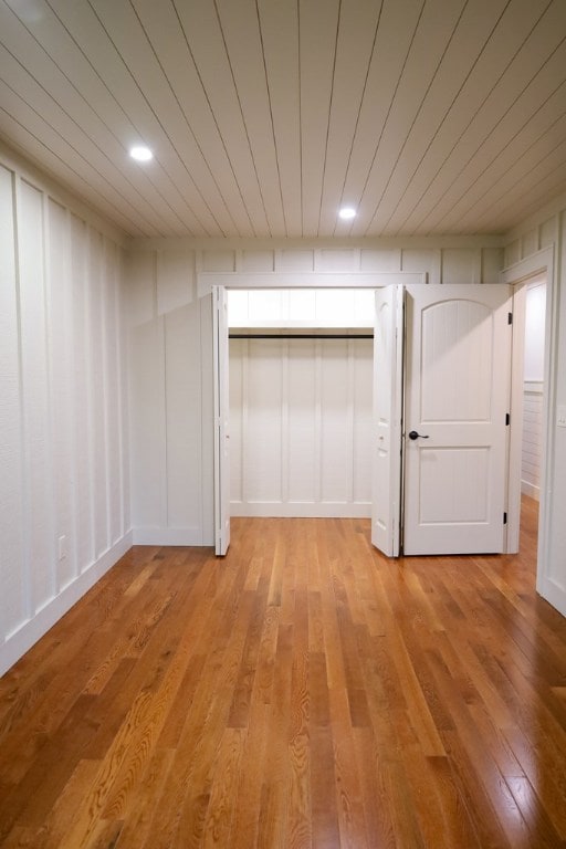 94 Breezy Knob Rd, Franklin, NC 28734 - unfurnished bedroom featuring wooden ceiling, light wood-type flooring, and recessed lighting
