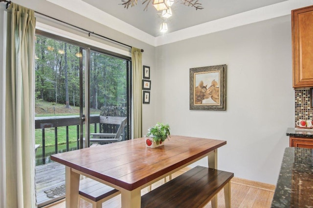 dining room featuring baseboards and light wood-style floors