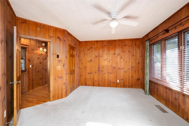 334 Back Nine Ln, Sapphire, NC 28774 - carpeted empty room featuring wood walls and ceiling fan