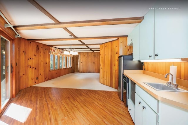334 Back Nine Ln, Sapphire, NC 28774 - kitchen featuring wooden walls, light wood-style floors, light countertops, a chandelier, and beamed ceiling