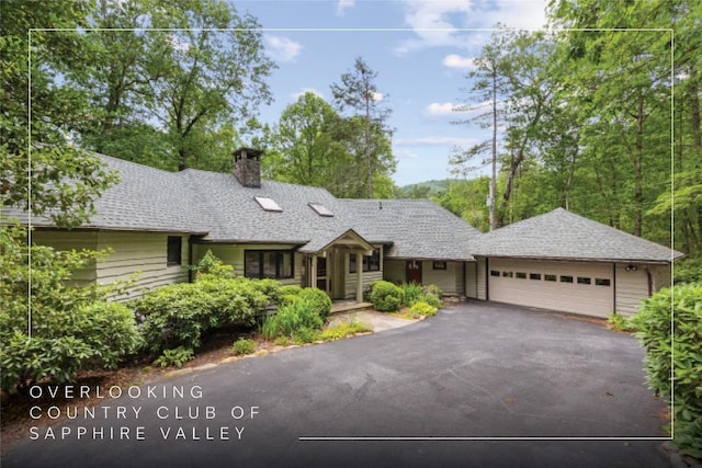 334 Back Nine Ln, Sapphire, NC 28774 - ranch-style home with a chimney, driveway, and an attached garage
