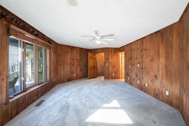 334 Back Nine Ln, Sapphire, NC 28774 - carpeted spare room featuring a ceiling fan and wooden walls