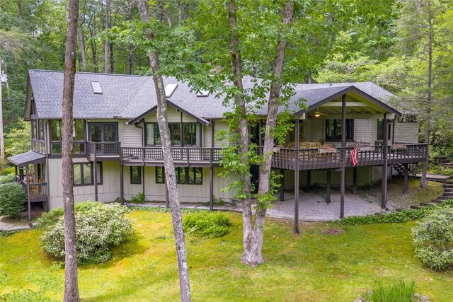 334 Back Nine Ln, Sapphire, NC 28774 - back of property with roof with shingles, a deck, and a lawn