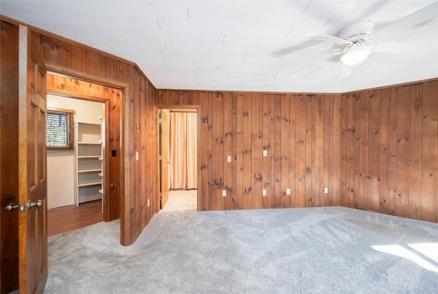 334 Back Nine Ln, Sapphire, NC 28774 - unfurnished room featuring carpet floors, wood walls, and a ceiling fan