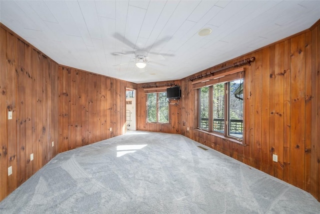 334 Back Nine Ln, Sapphire, NC 28774 - carpeted empty room featuring a ceiling fan and wood walls