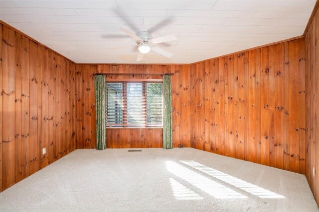 334 Back Nine Ln, Sapphire, NC 28774 - carpeted empty room featuring wood walls and a ceiling fan