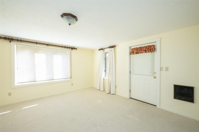 334 Back Nine Ln, Sapphire, NC 28774 - unfurnished living room featuring heating unit and carpet