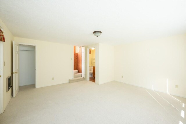 334 Back Nine Ln, Sapphire, NC 28774 - empty room featuring light colored carpet and stairway