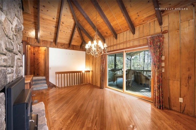 334 Back Nine Ln, Sapphire, NC 28774 - unfurnished living room with hardwood / wood-style flooring, a chandelier, wood walls, high vaulted ceiling, and a wood ceiling with exposed beams