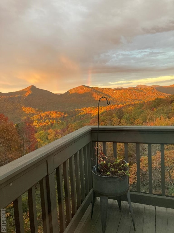 balcony at dusk with a mountain view