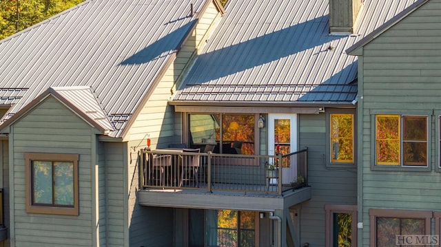 back of property with a balcony