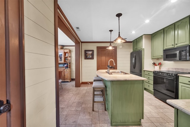 55 Toxaway Shrs Unit 14, Lake Toxaway, NC 28747 - kitchen featuring green cabinets, black appliances, a kitchen breakfast bar, pendant lighting, and recessed lighting