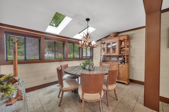 55 Toxaway Shrs Unit 14, Lake Toxaway, NC 28747 - dining room with a skylight, a chandelier, vaulted ceiling, and wooden walls