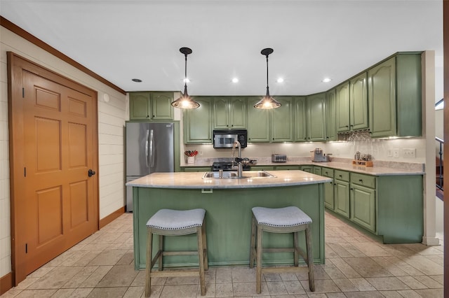 55 Toxaway Shrs Unit 14, Lake Toxaway, NC 28747 - kitchen featuring green cabinets, stainless steel appliances, a breakfast bar, light countertops, and decorative light fixtures