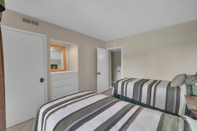 55 Toxaway Shrs Unit 14, Lake Toxaway, NC 28747 - carpeted bedroom featuring a textured ceiling