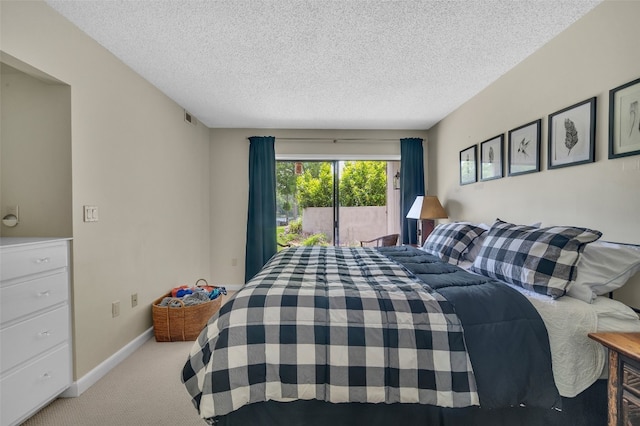 55 Toxaway Shrs Unit 14, Lake Toxaway, NC 28747 - carpeted bedroom with a textured ceiling and access to exterior