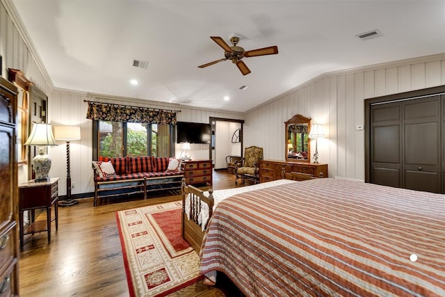 515 Stillmont Cir, Cashiers, NC 28717 - bedroom with ornamental molding, wood finished floors, vaulted ceiling, a decorative wall, and ceiling fan