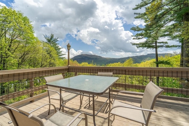 515 Stillmont Cir, Cashiers, NC 28717 - wooden terrace with outdoor dining area and a mountain view