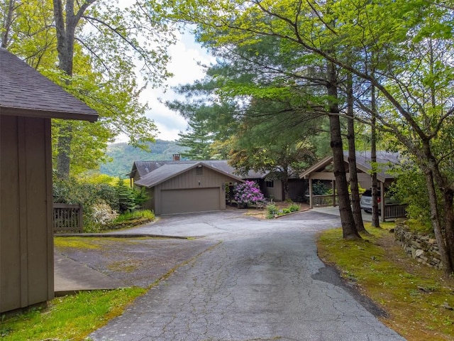 515 Stillmont Cir, Cashiers, NC 28717 - view of front of house featuring driveway and a garage