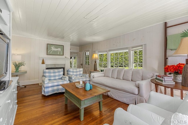 living room featuring wood-type flooring and wooden ceiling