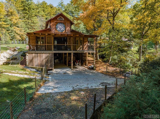 back of property featuring a carport