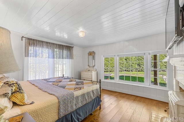 bedroom with wood-type flooring and wood ceiling