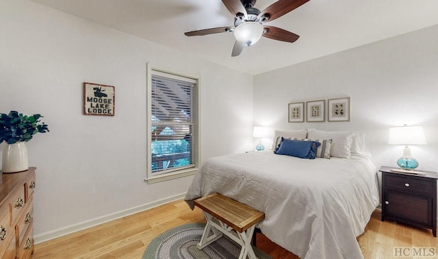 bedroom featuring light hardwood / wood-style floors and ceiling fan