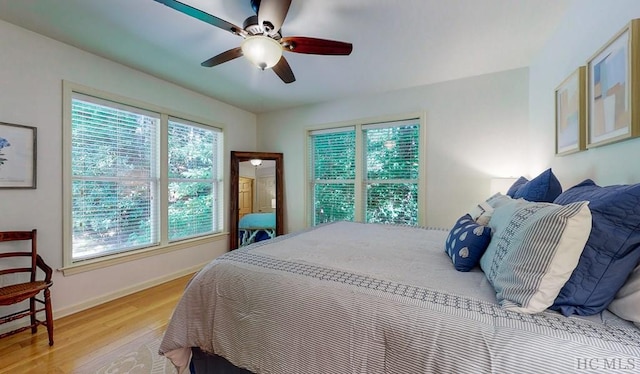 bedroom featuring ceiling fan and light hardwood / wood-style flooring