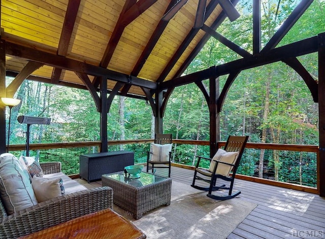 wooden deck featuring a gazebo and an outdoor hangout area