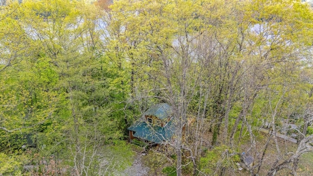 view from above of property featuring a forest