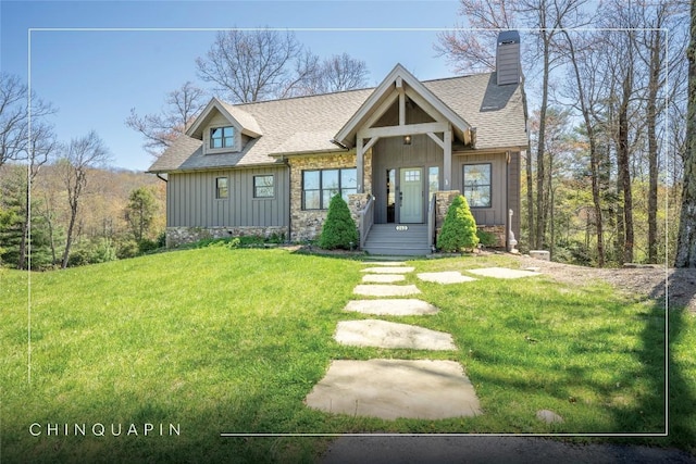 craftsman inspired home with board and batten siding, a chimney, roof with shingles, and a front lawn