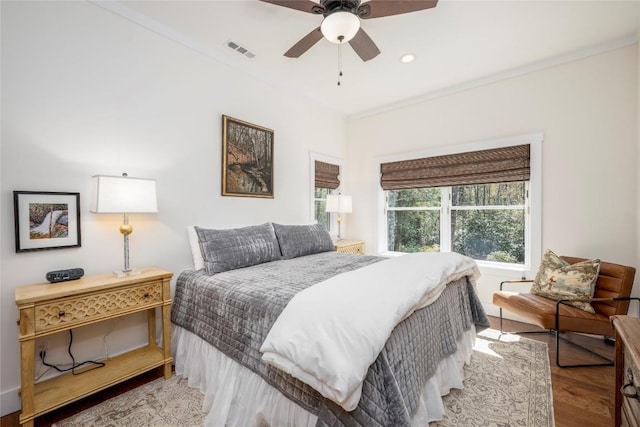 bedroom featuring a ceiling fan, recessed lighting, wood finished floors, and visible vents