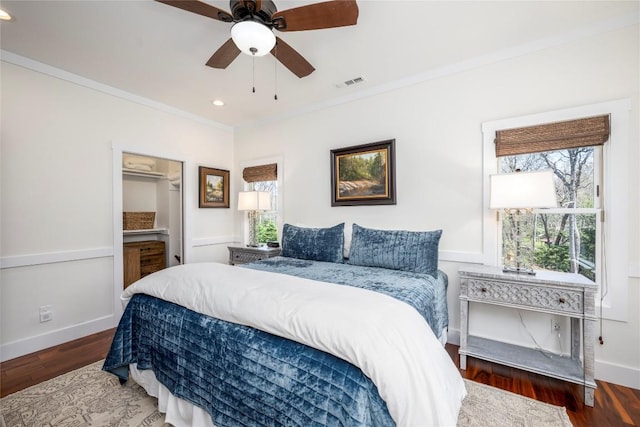 bedroom with visible vents, ornamental molding, wood finished floors, and recessed lighting