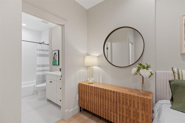 1077 Hicks Rd Unit A, Highlands, NC 28741 - bathroom with vanity, toilet, shower / bathtub combination with curtain, and wood finished floors