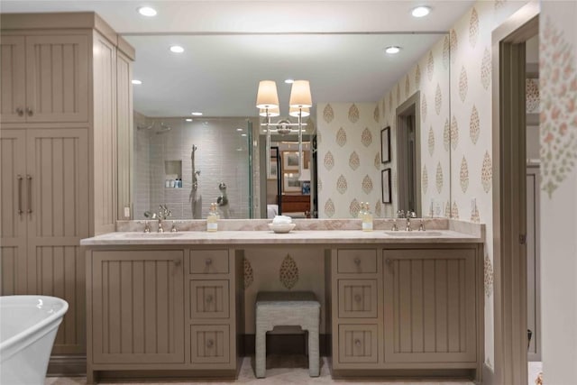 358 Jodytown Rd, Cashiers, NC 28717 - bathroom featuring tiled shower, double vanity, recessed lighting, a freestanding tub, and wallpapered walls