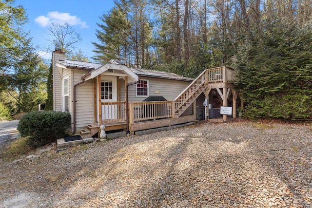 view of front of house with a wooden deck