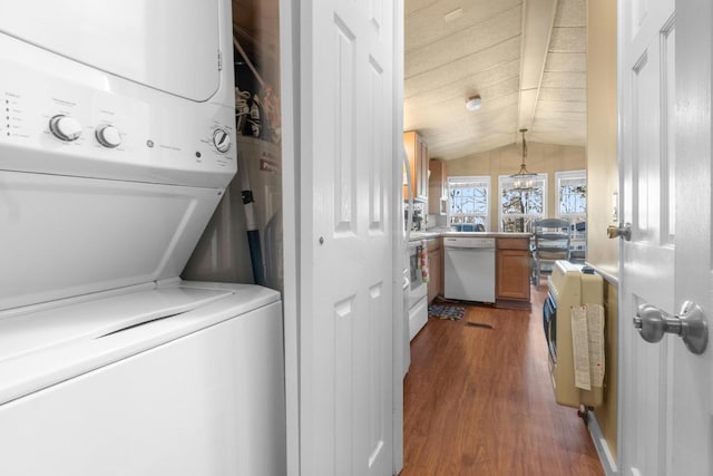 washroom featuring heating unit, stacked washer and dryer, and dark hardwood / wood-style floors