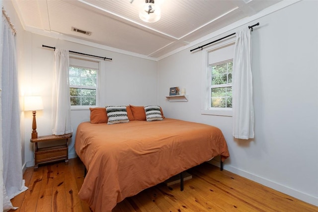 4860 Horse Cove Rd, Highlands, NC 28741 - bedroom with light wood-style floors, multiple windows, and baseboards