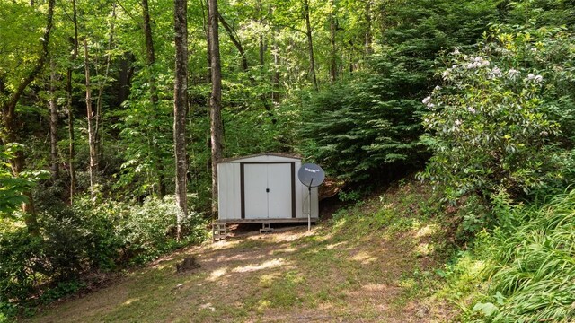 4860 Horse Cove Rd, Highlands, NC 28741 - view of shed featuring a wooded view
