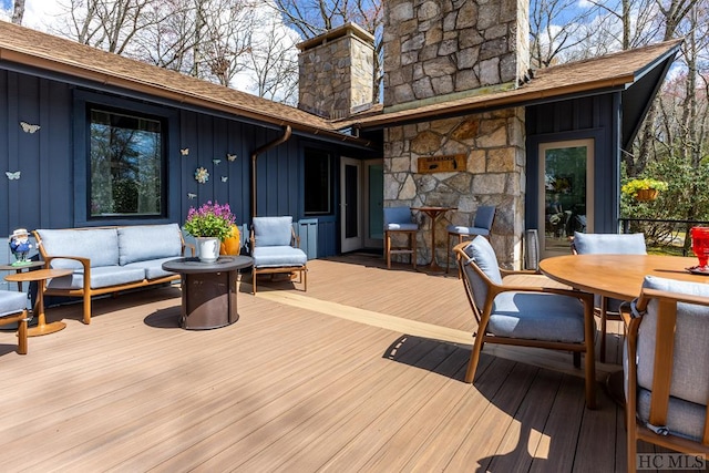 deck featuring outdoor lounge area