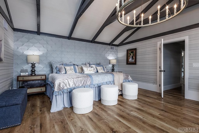 bedroom with hardwood / wood-style flooring and lofted ceiling with beams